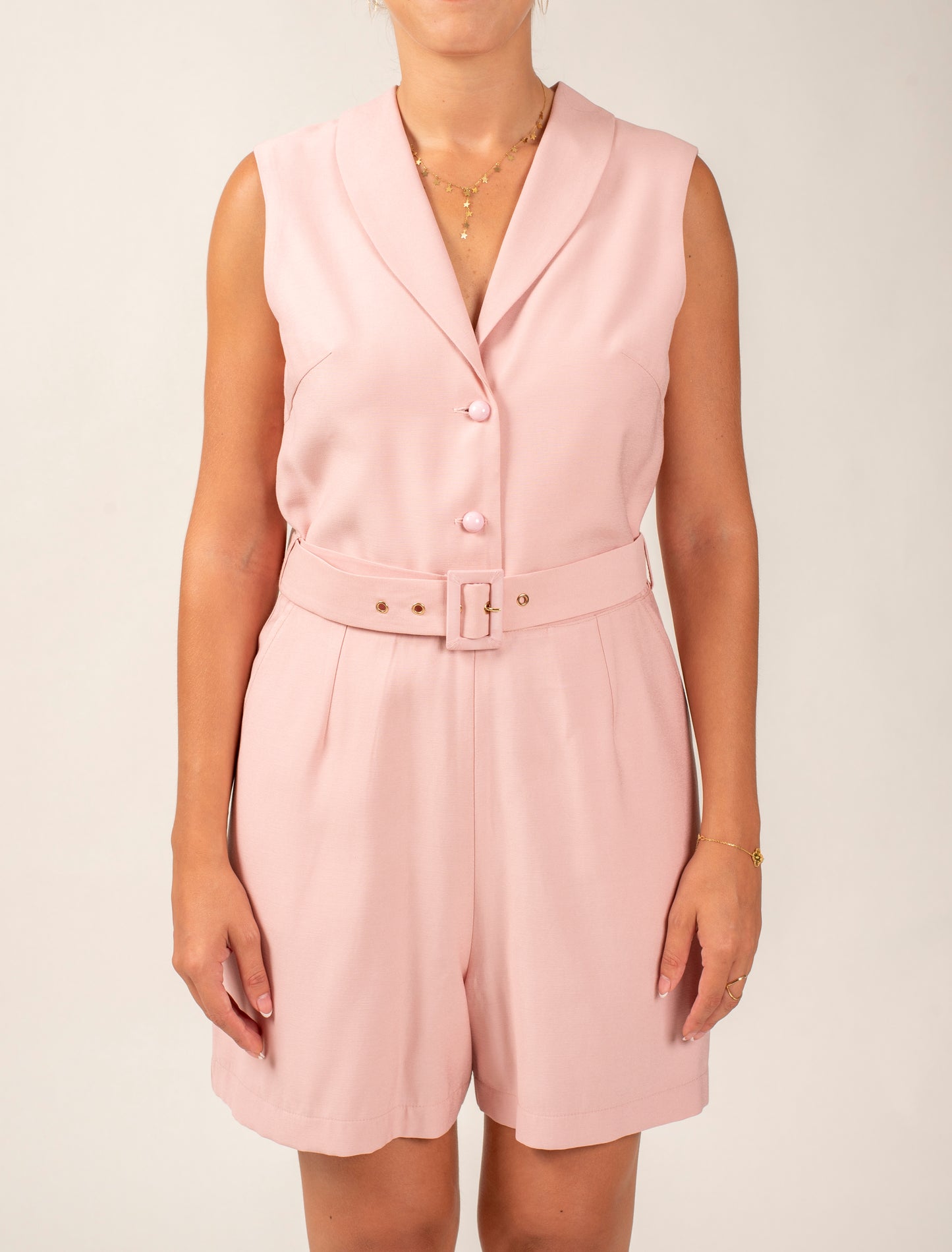 Sleeveless Short Jumpsuit Featuring Shawl Lapel and a Waist Belt